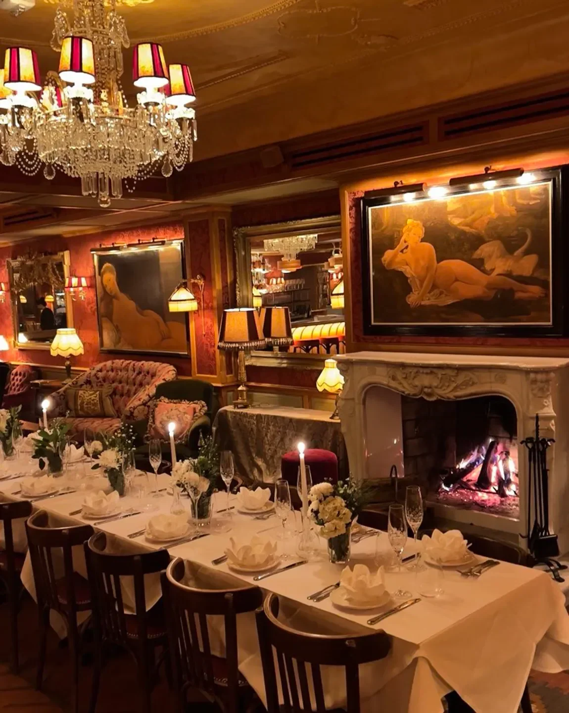 Elegant dining at Maison Nouvelle in Bordeaux, with fireplace and art-filled walls.