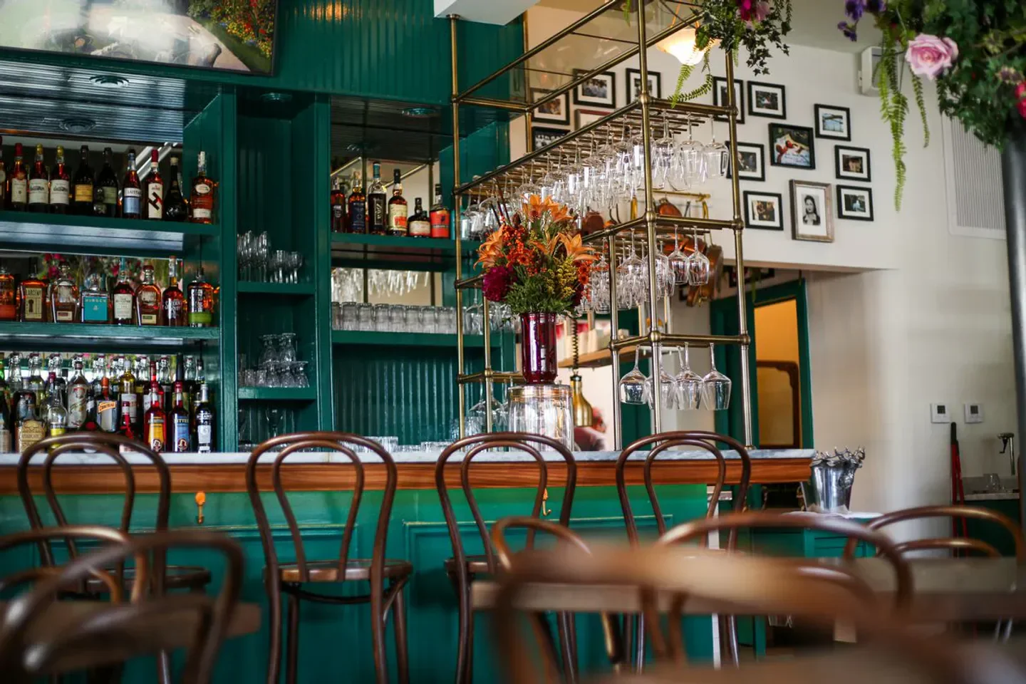 Interior bar at MaMou in New Orleans, with stylish decor and flower arrangement.
