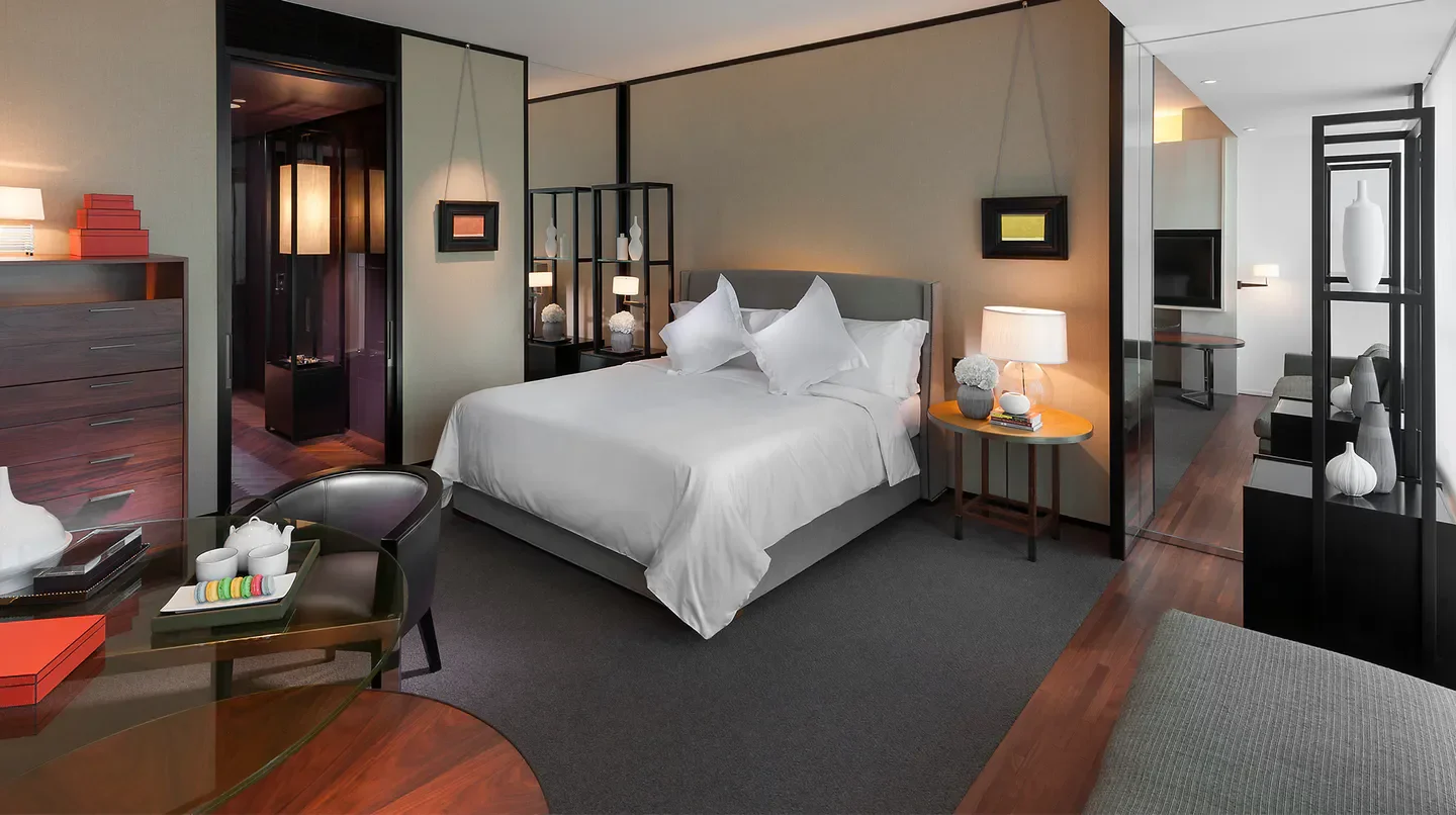 Modern hotel room at Mandarin Oriental, Guangzhou, with a luxurious bed and tea setting