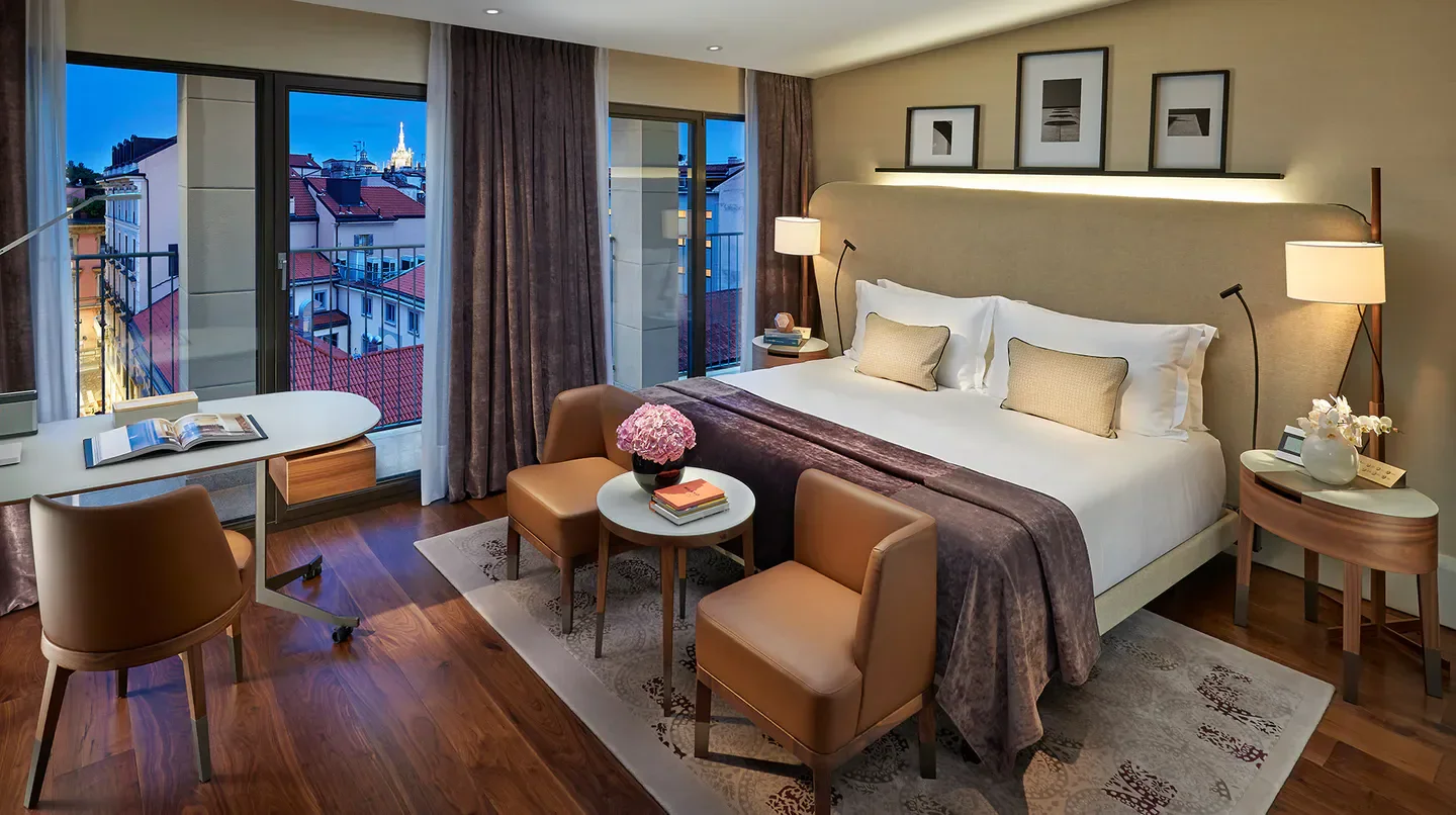 Cozy bedroom at Mandarin Oriental, Milan with a view of the city of Milan.