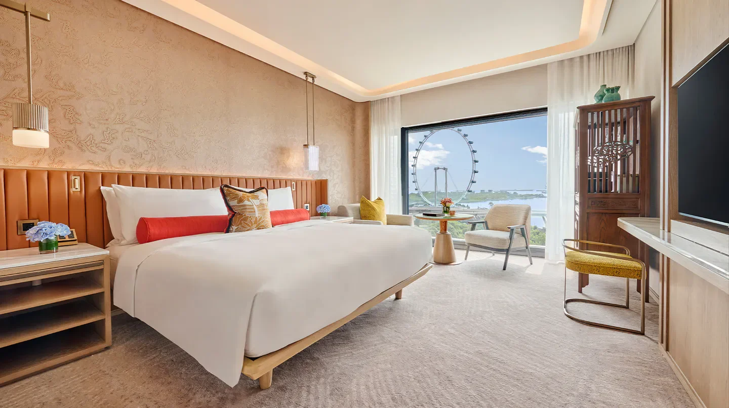 Luxury hotel room at Mandarin Oriental, Singapore, featuring views of Singapore Flyer.