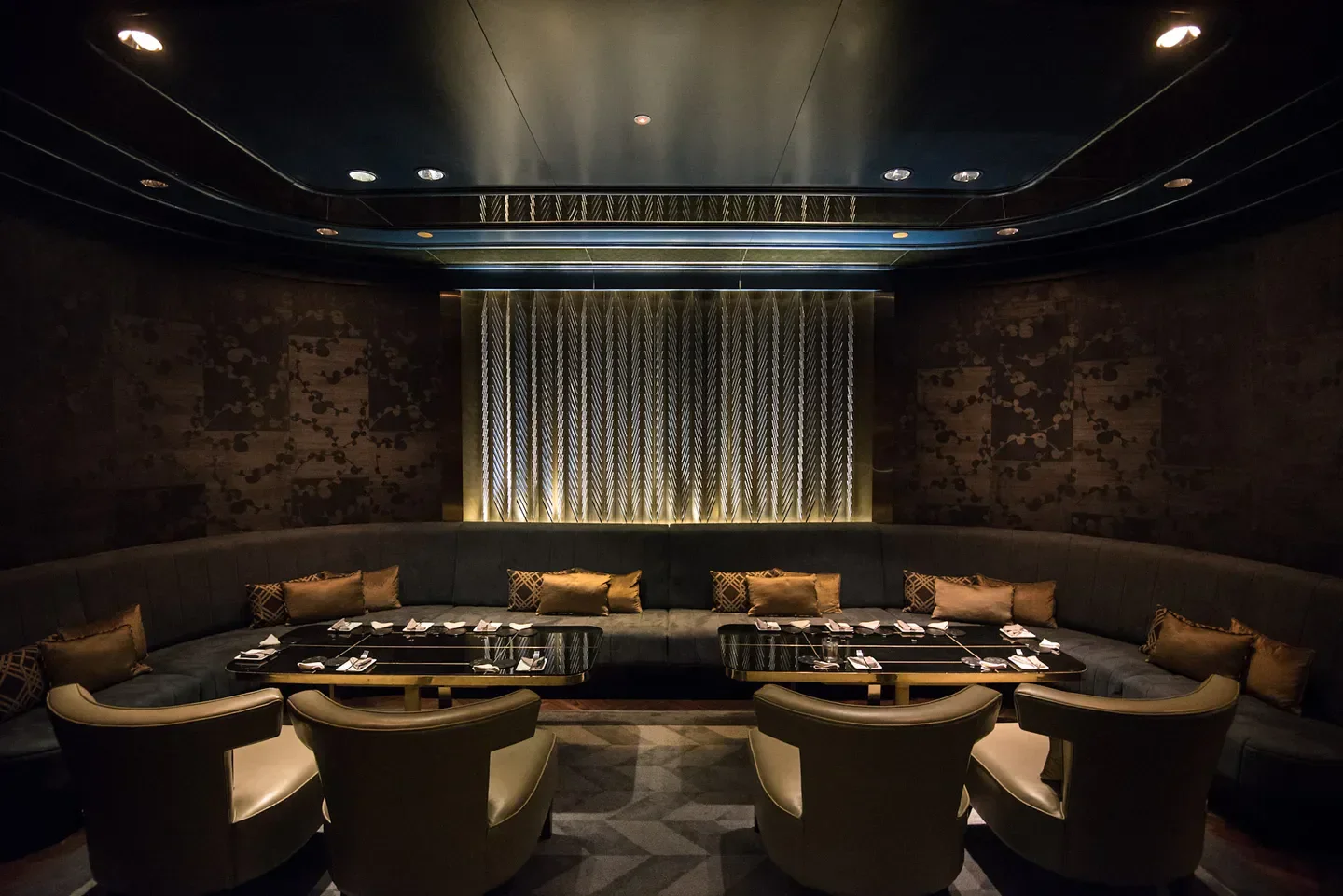 Manhattan Singapore restaurant's stylish interior with intimate seating and elegant design.