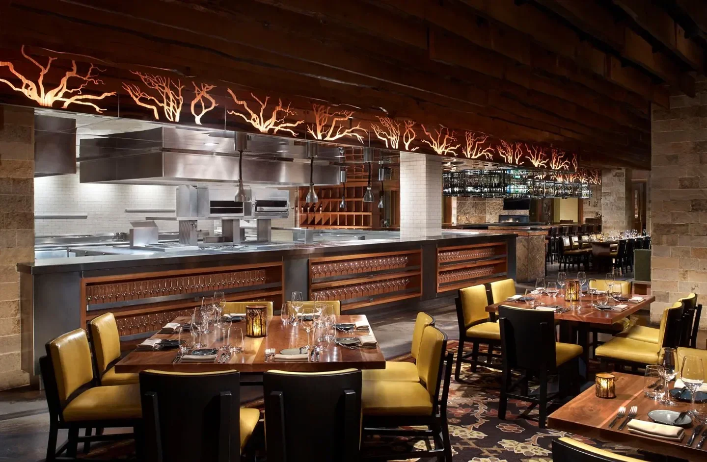 Manzanita restaurant in Tahoe: elegant dining room with open kitchen and wood accents.