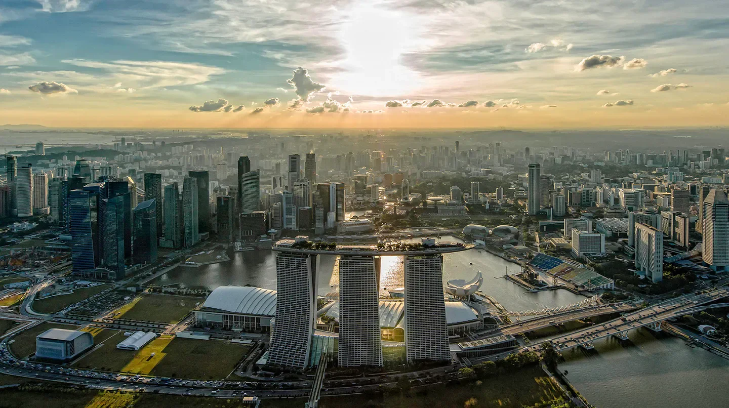 Aerial view of the Marina Bay Sands hotel in Singapore during a beautiful sunset.