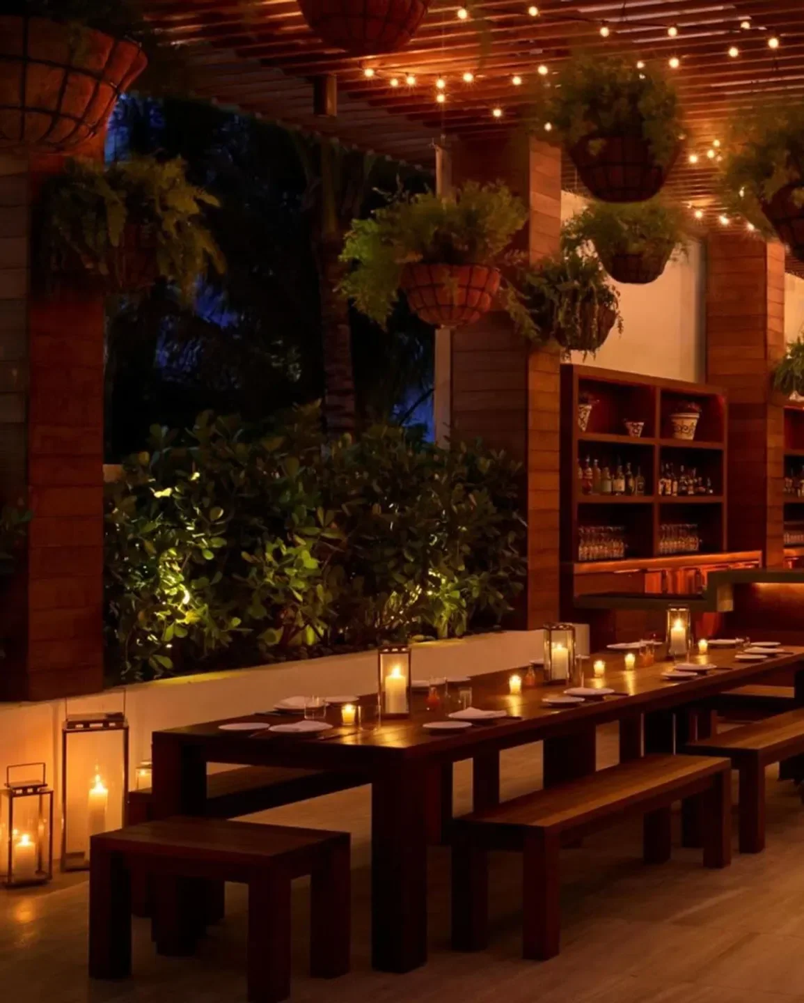 Cozy dining setting at Matador Room in Miami, lit by candles and string lights