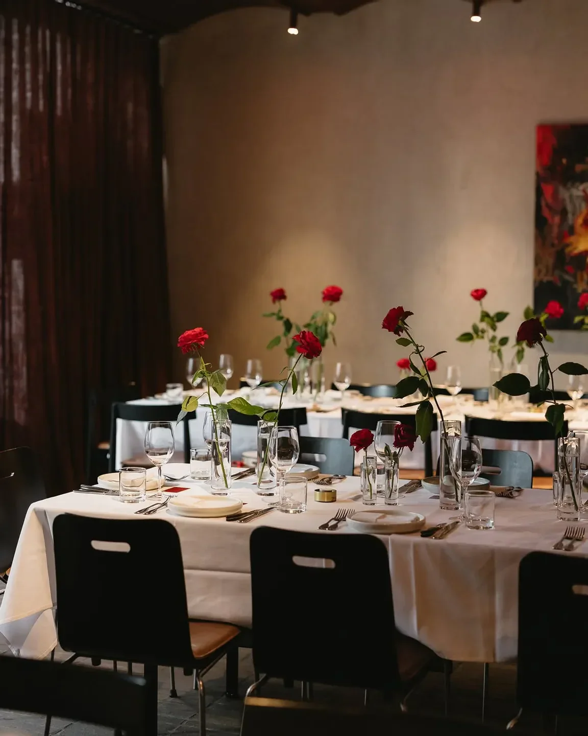 Elegant dining at Matilda 159 Domain restaurant in Melbourne with rose centerpieces.