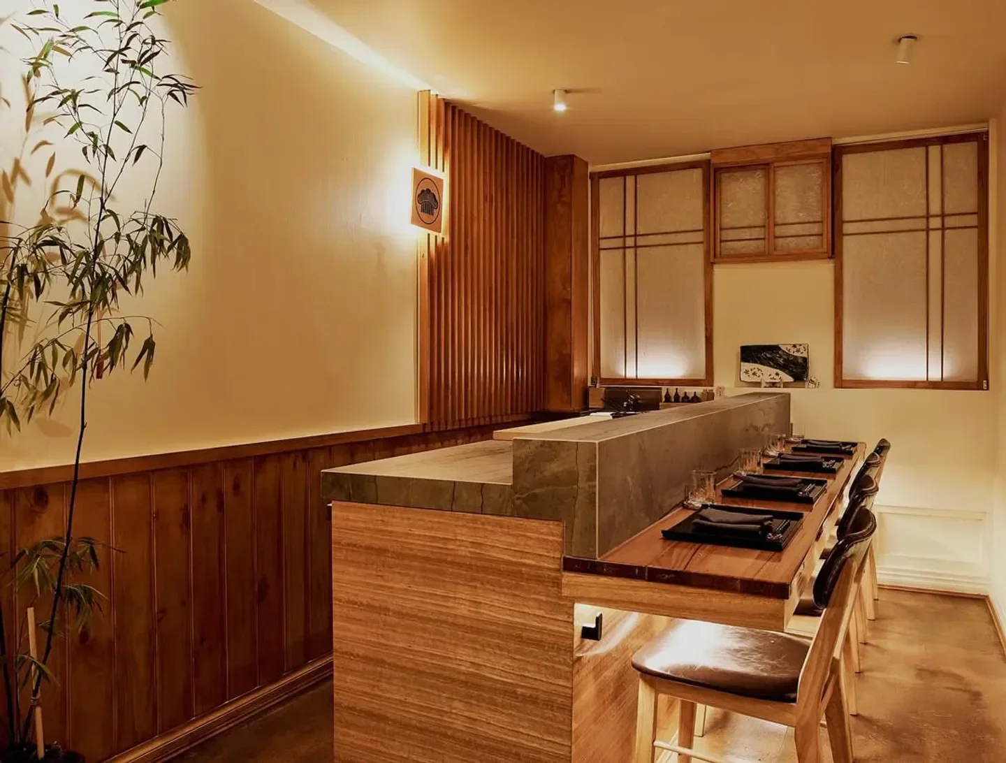 Interior of MATSU restaurant in Melbourne, featuring elegant wooden design and seating.