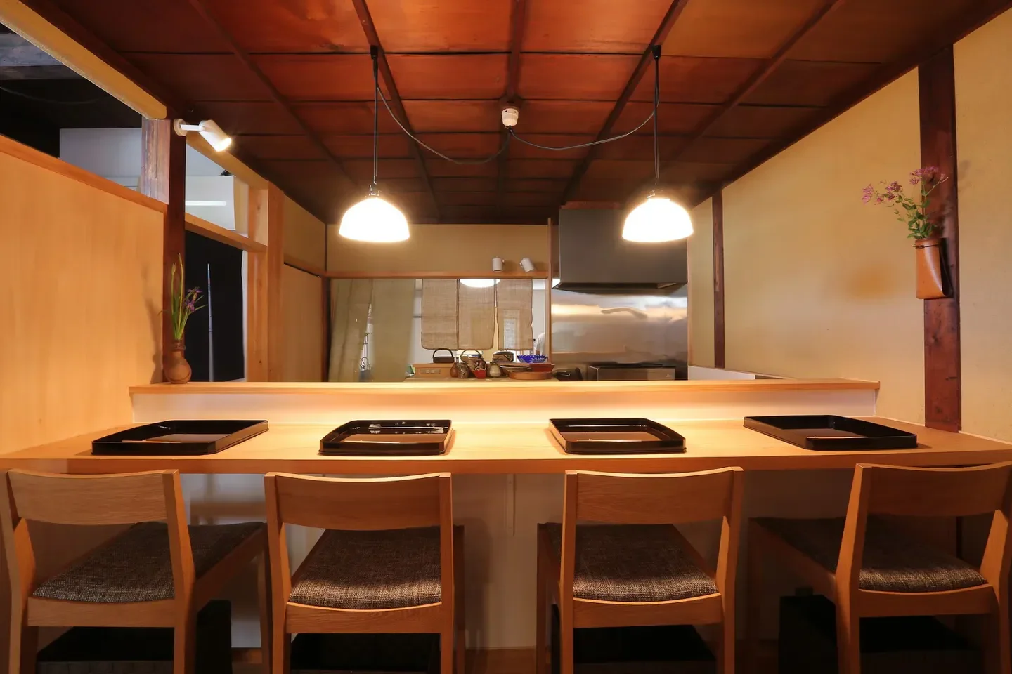 Cozy interior of Matsuki restaurant in Nara, featuring wooden tables and elegant lighting.