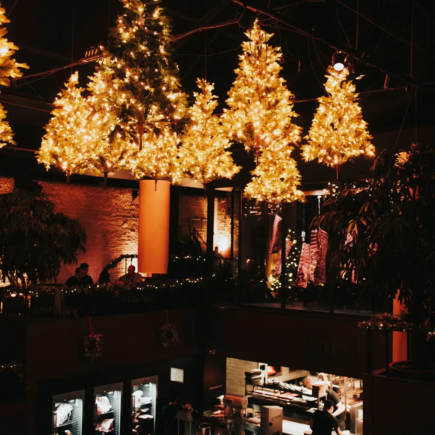 Festive Christmas decor at Maven restaurant in Antwerp, Belgium with warm lights.