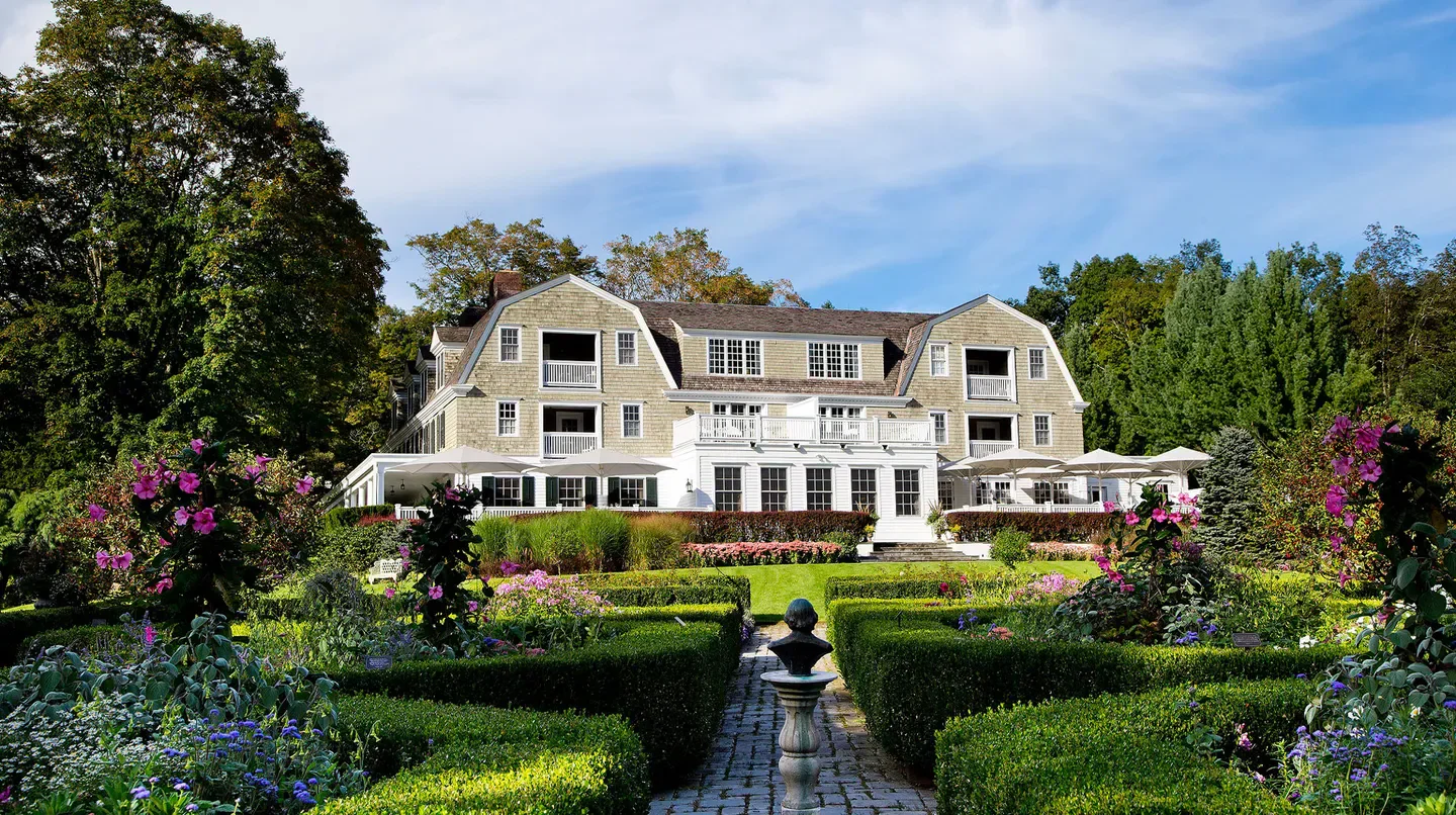Mayflower Inn & Spa in Washington, a charming hotel with lush gardens and beautiful architecture.