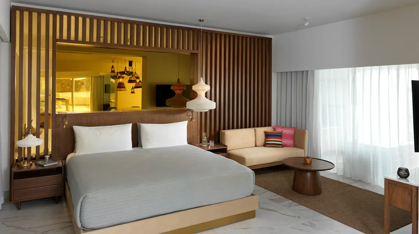 Stylish hotel room at ME Cabo in Cabo San Lucas, with wooden accents and modern design