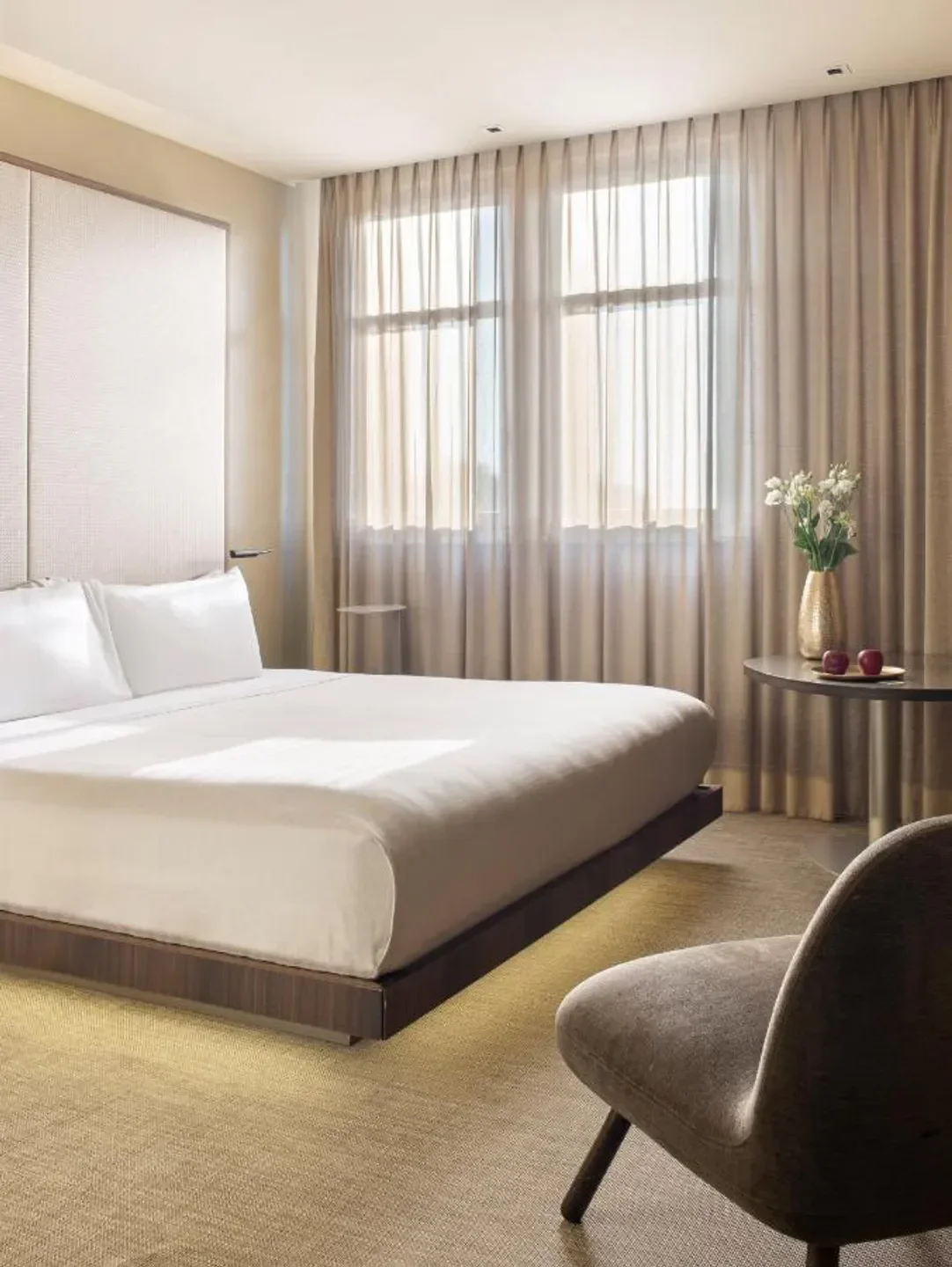 Cozy bedroom at ME Milan Il Duca hotel in Milan, featuring comfortable bed and natural light.