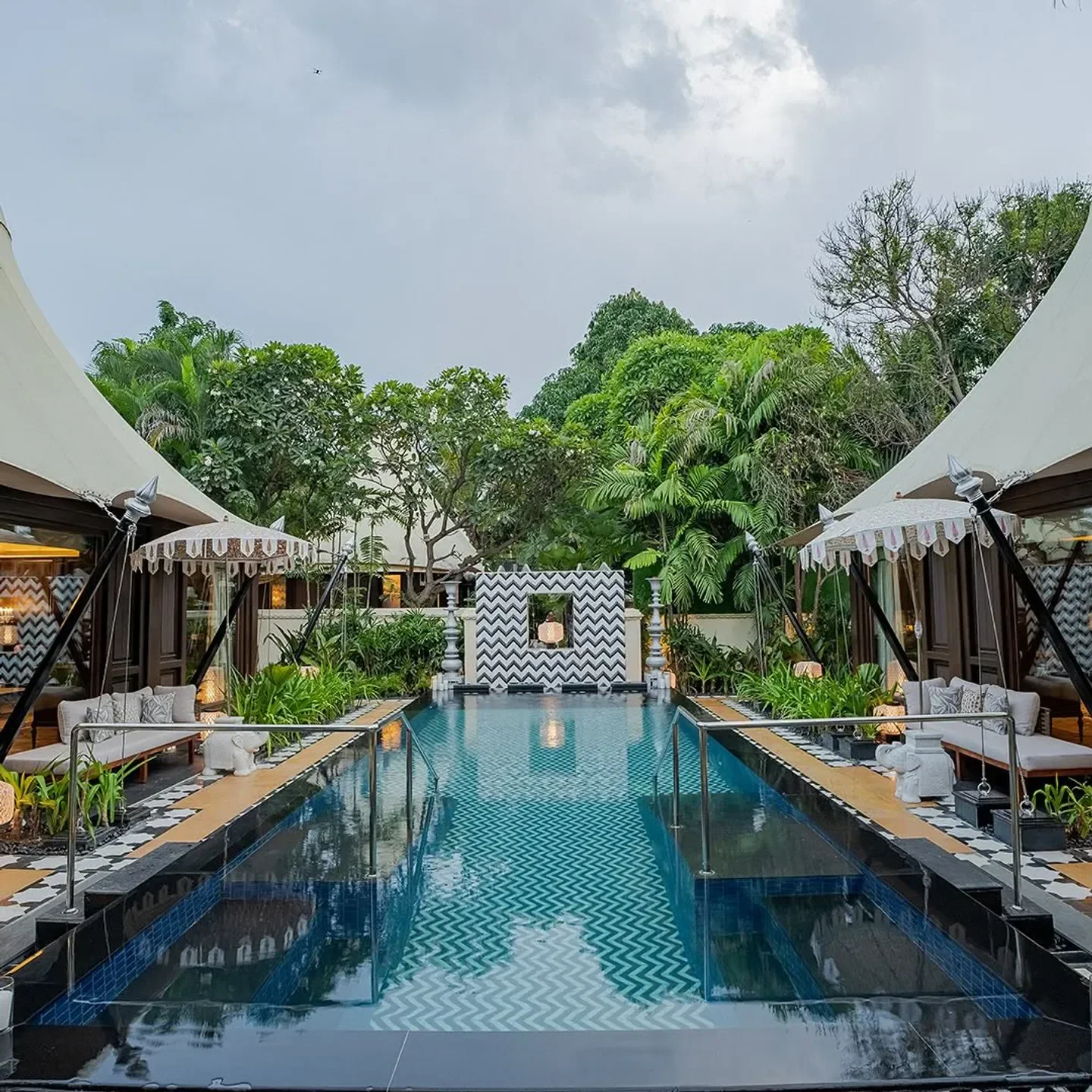 Outdoor pool and seating at Megu restaurant in New Delhi, elegant dining experience.