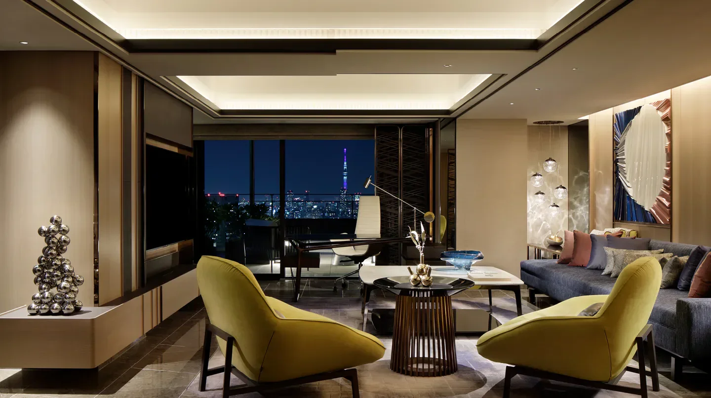 Luxury suite at mesm Tokyo, Autograph Collection, showcasing city views of Tokyo at night.