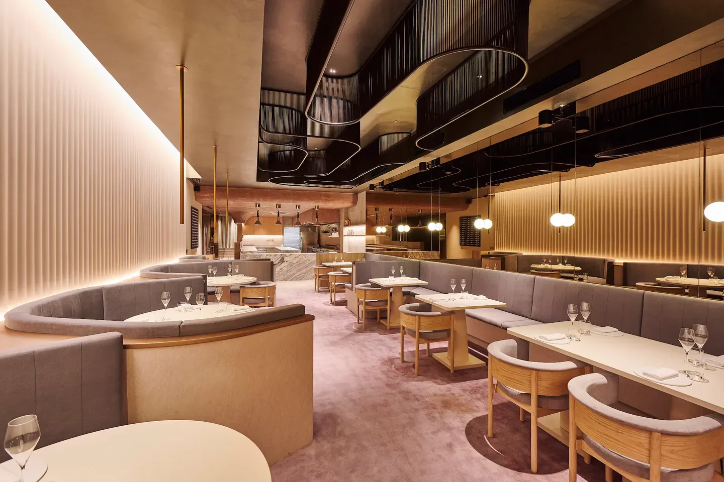 Interior of Meta restaurant in Singapore, featuring stylish seating and warm lighting.