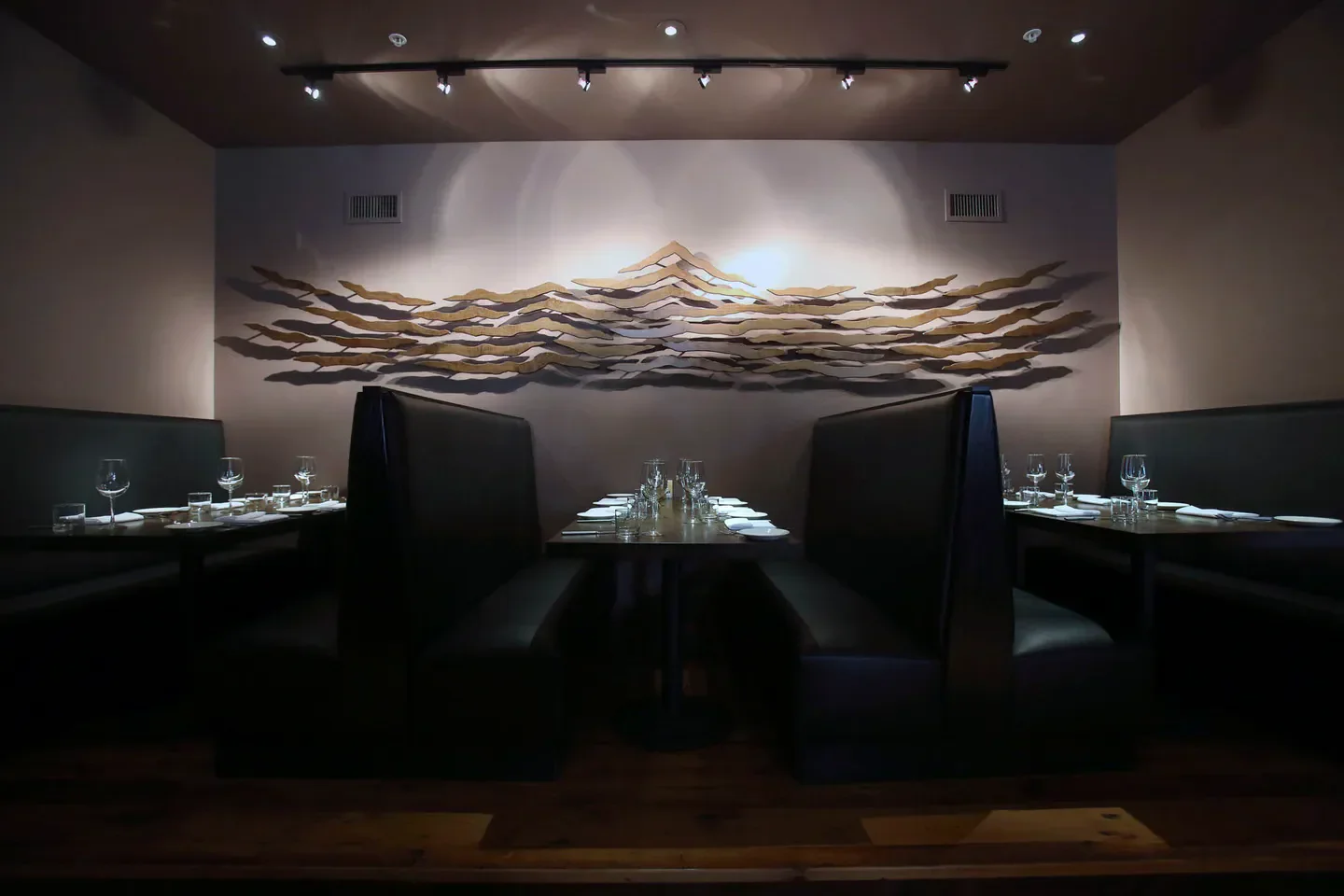 Elegant dining at Michaelangelo’s Big Sky restaurant in Southern Montana, with booth seating.