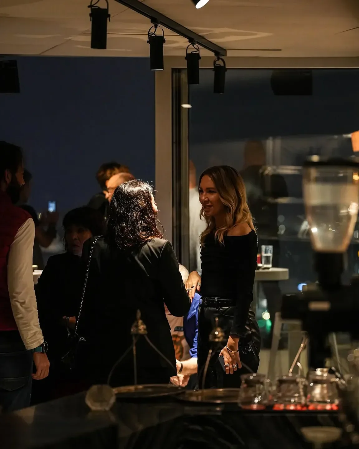 Elegant patrons at Mikla restaurant in Istanbul enjoying a night out