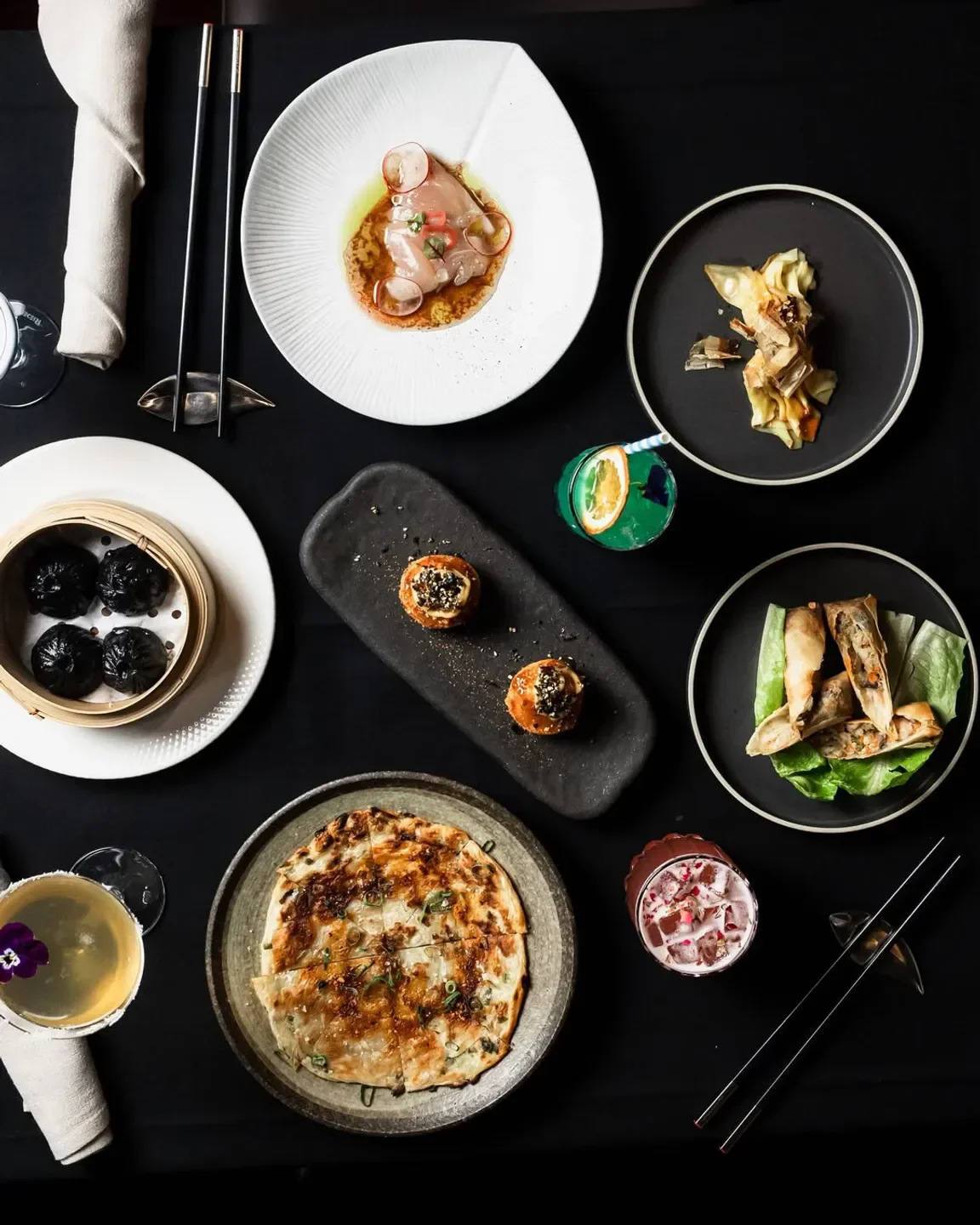 Delicious dishes and cocktails at MING Dining in Melbourne, an elegant dining experience.