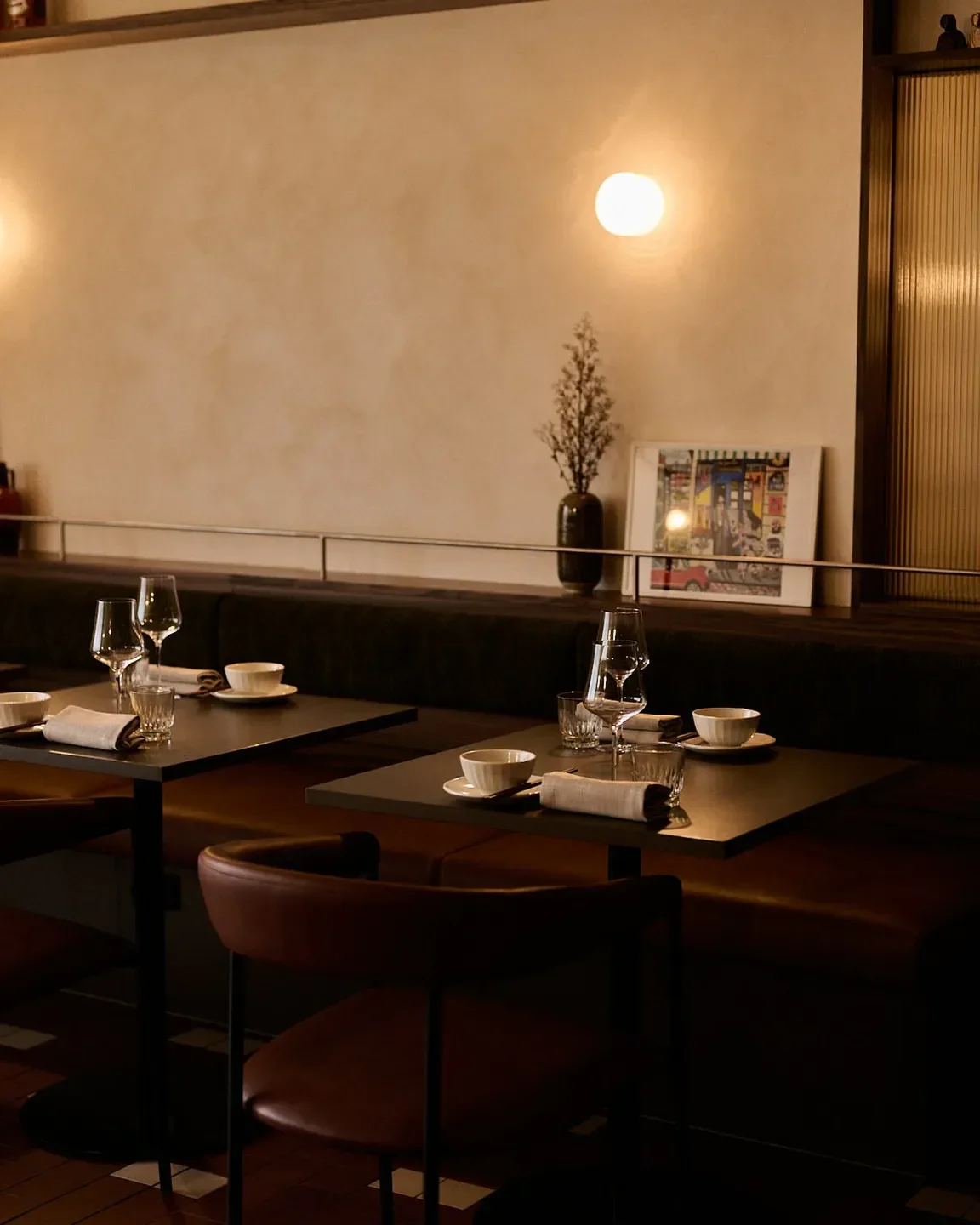 Interior of Mínima restaurant in Canberra, with tables set for dining in a cozy ambiance.