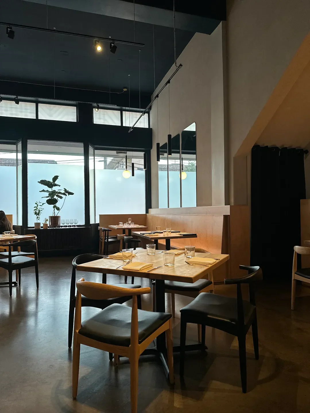 Interior dining at Miro Kaimuki restaurant in Honolulu. Tables set and ready for service.