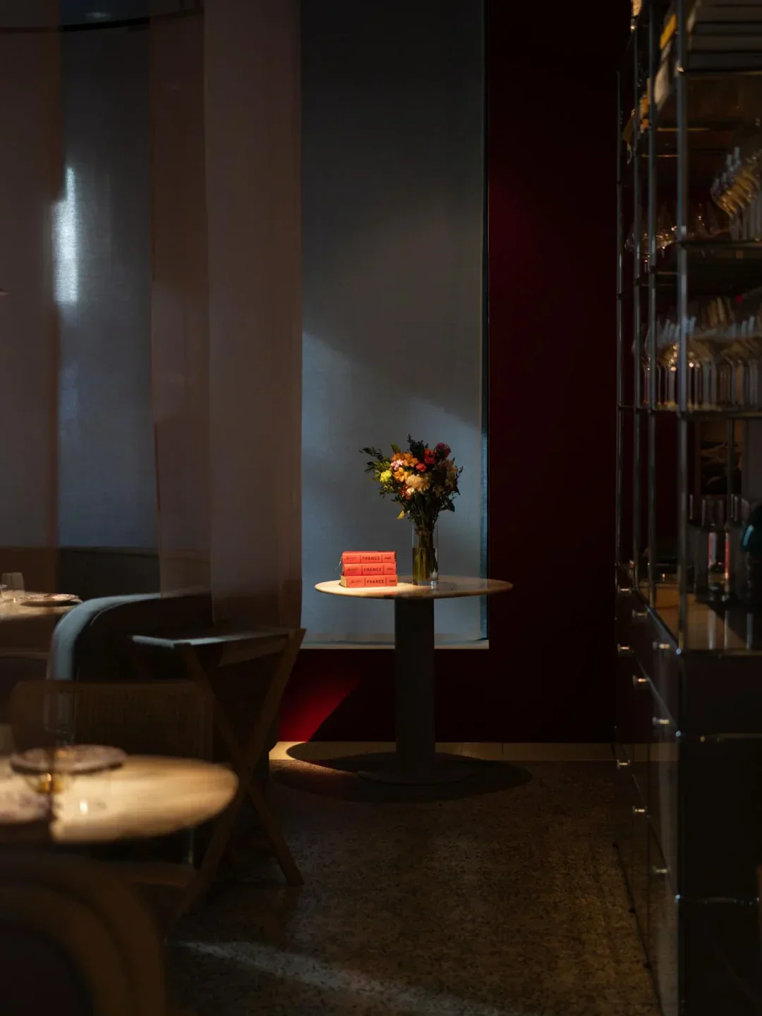 Interior shot of Mon Oncle restaurant in Oslo, featuring floral decor and elegant design.