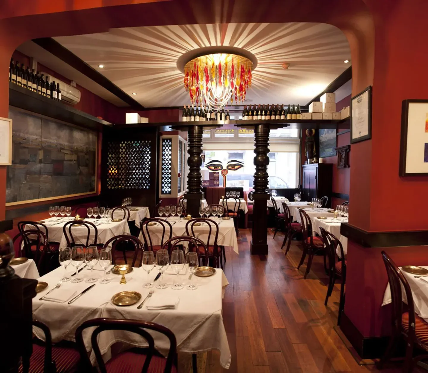 Interior of Montys Of Kathmandu in Dublin, featuring tables set for fine dining.