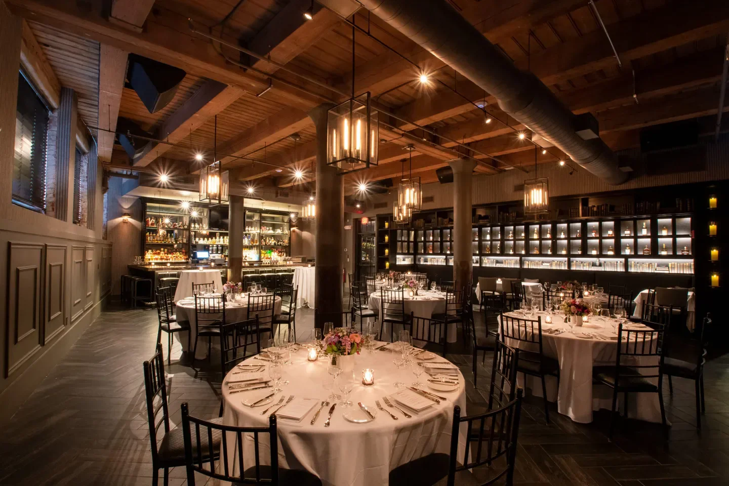 Elegant dining room at Mooo.... restaurant in Boston, with inviting lighting and tables.