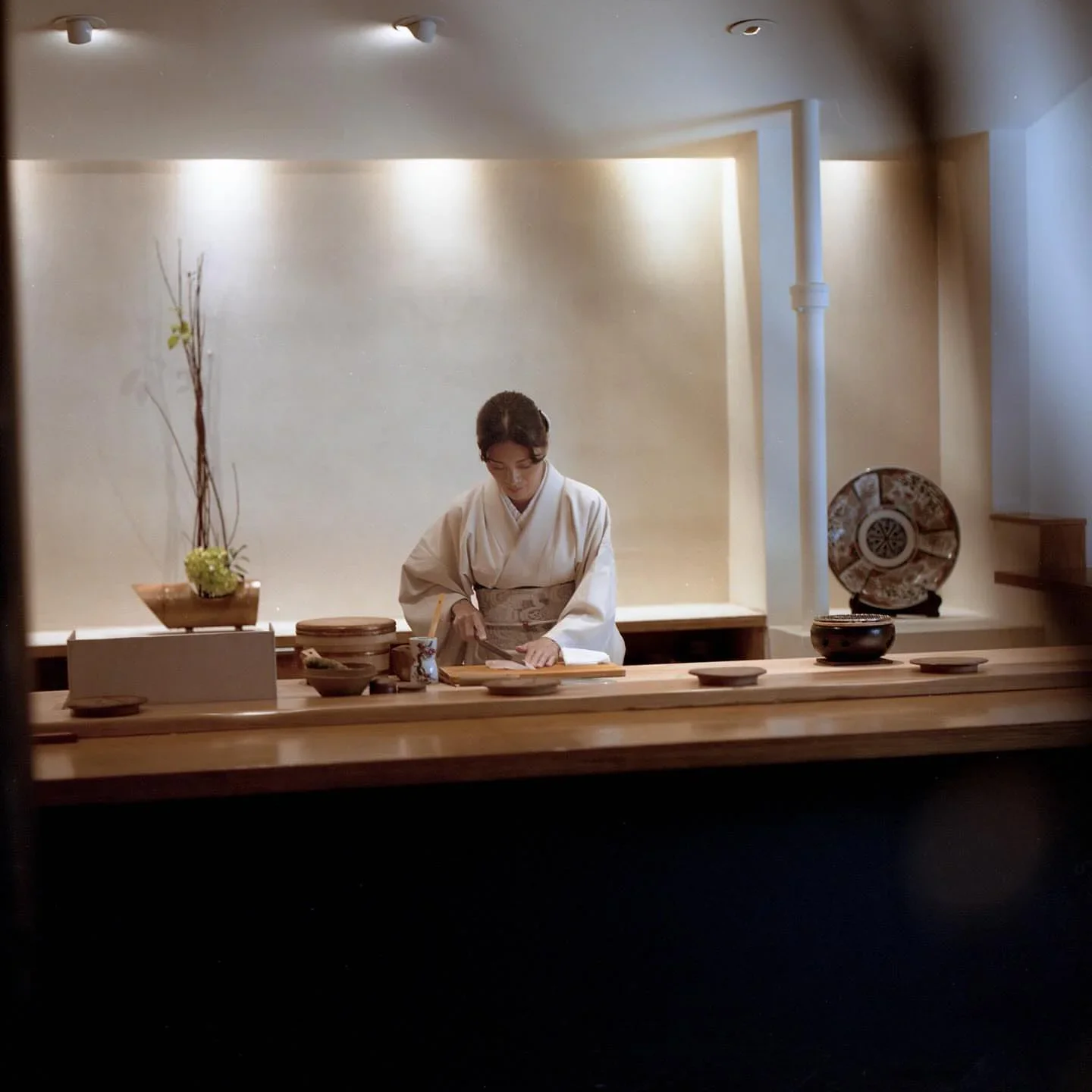 Mori Nozomi sushi chef prepares delicate dishes at the bar in the city