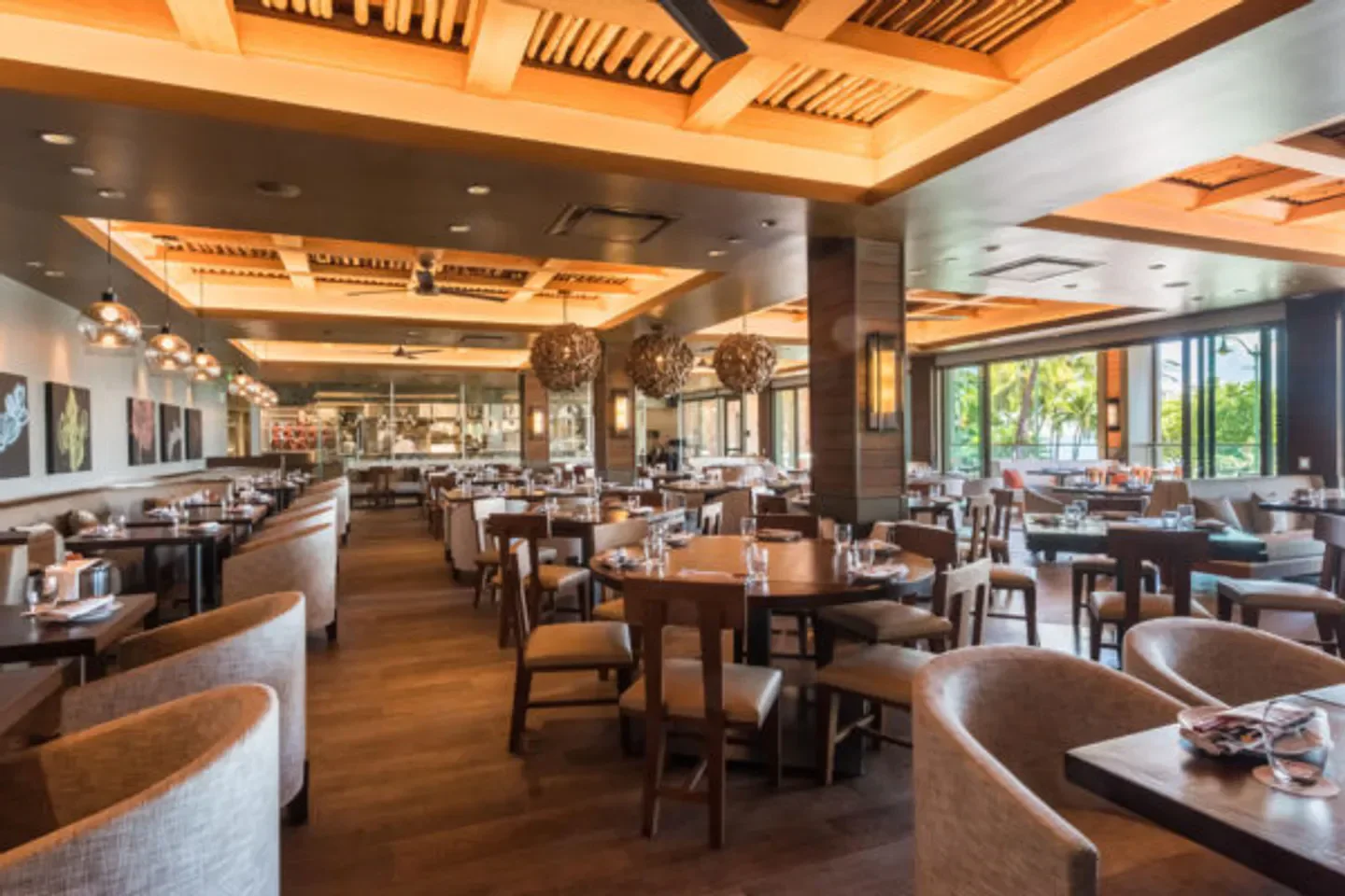 Interior dining area at Morimoto Asia in Honolulu, featuring stylish decor and seating.
