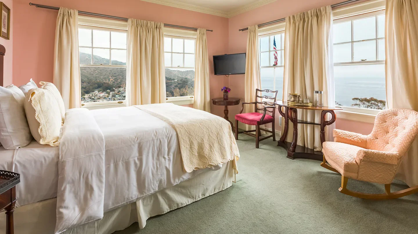 Cozy bedroom with views at Mt. Ada in New Orleans. Hotel accommodation.