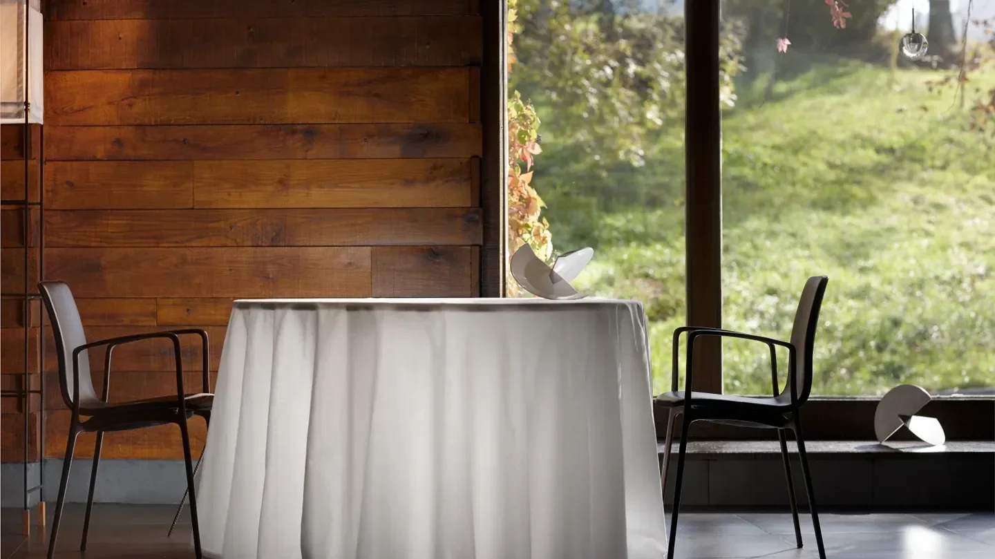 Elegant dining space at Mugaritz, San Sebastian, featuring a table set for guests