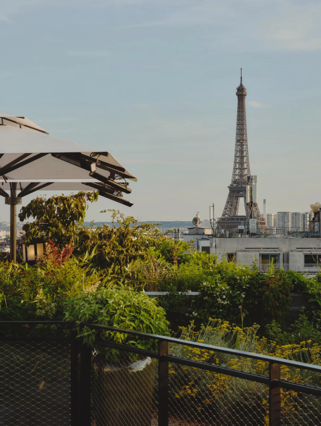 Mun Paris rooftop garden terrace with Eiffel Tower view and umbrellas