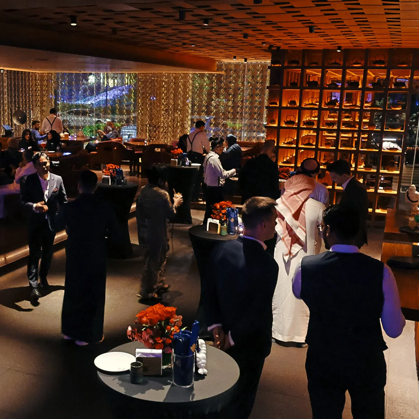 Interior ambiance at MYAZU Riyadh restaurant in Riyadh, Saudi Arabia, with guests and modern decor.