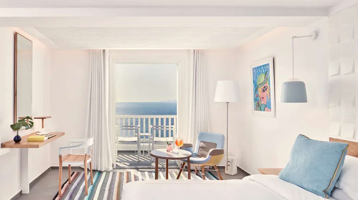Bright bedroom with sea view at Myconian Korali Relais & Chateaux Hotel in Mykonos