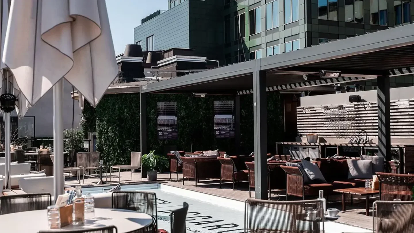 Outdoor seating at Naboterrassen restaurant in Stockholm, with a relaxed and inviting atmosphere