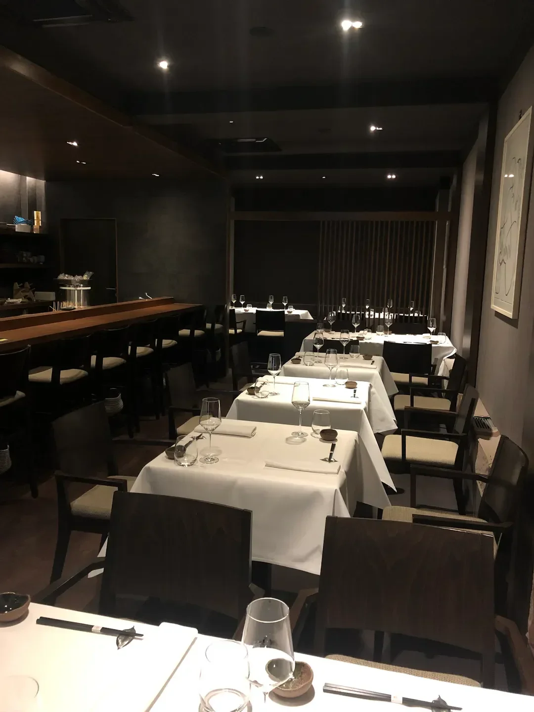 Elegant dining room interior at Nagaya restaurant in Düsseldorf, featuring set tables.