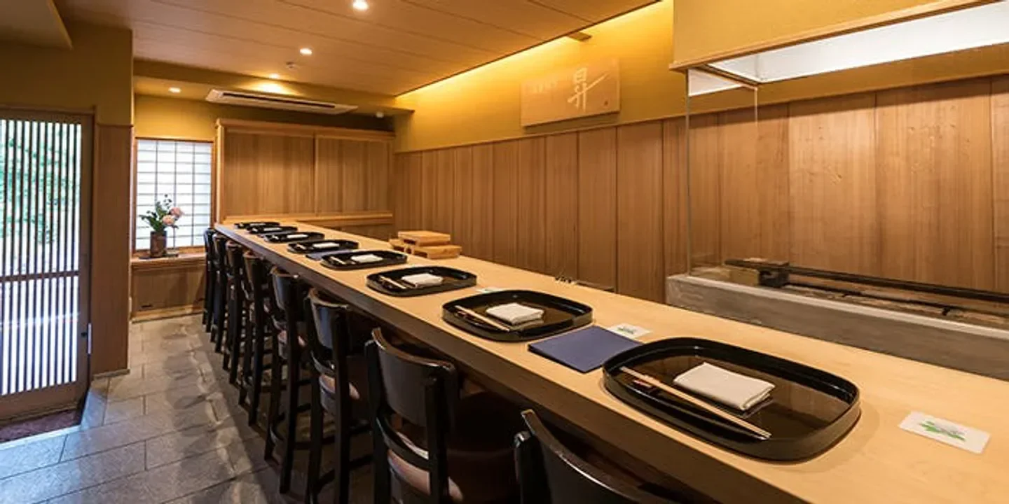 Elegant dining counter at Naniwakappo NOBORU restaurant in Osaka, Japan.