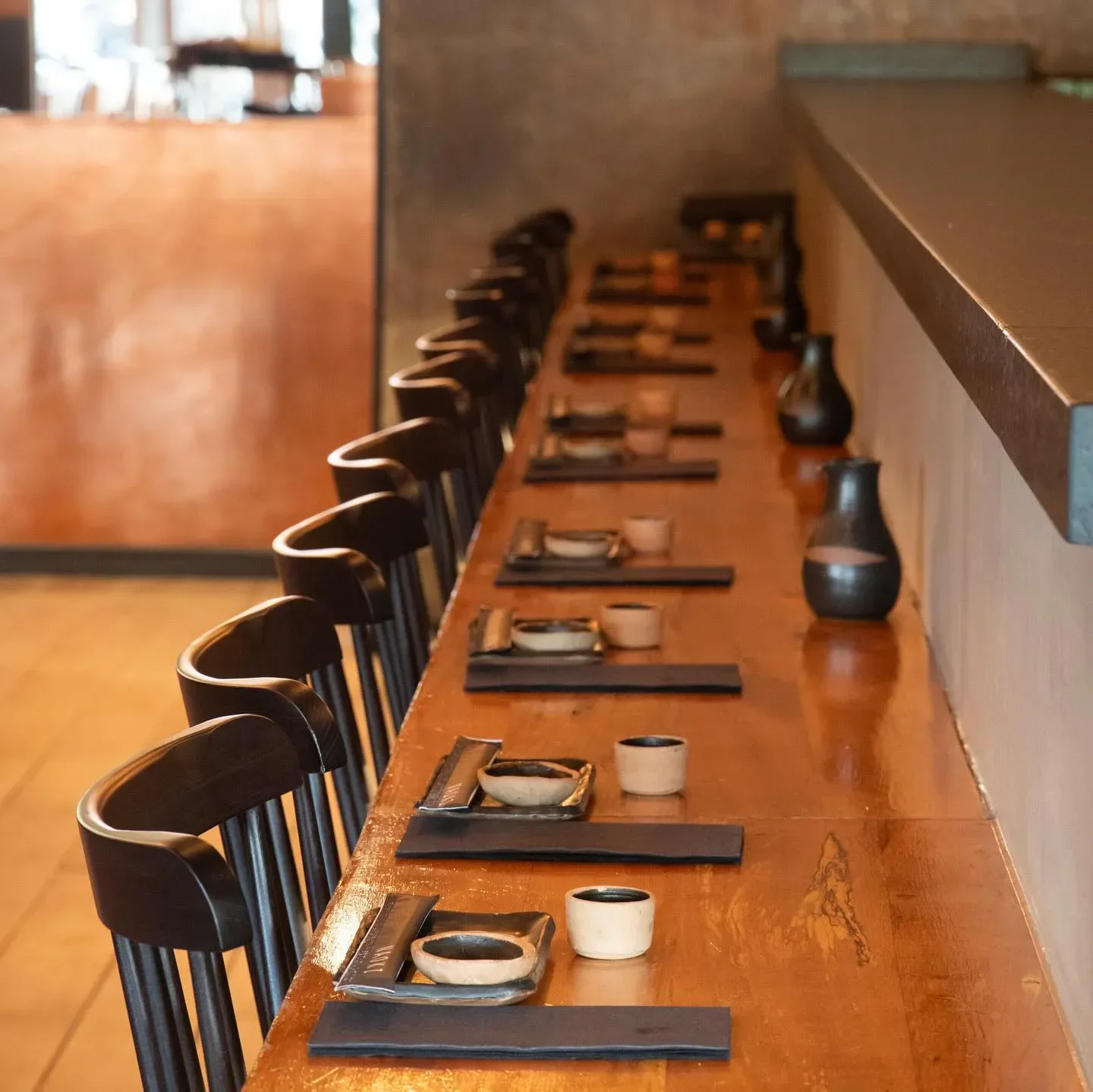 Elegant dining space at Naoki restaurant in Santiago, Chile, ready for guests.