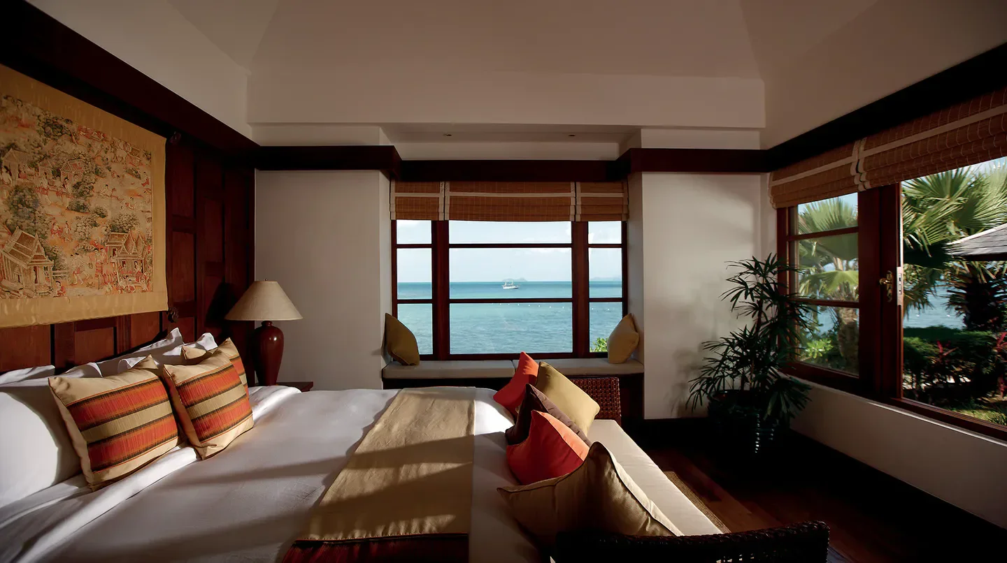 Bedroom view at Napasai, A Belmond Hotel, Koh Samui, with ocean and tropical garden.