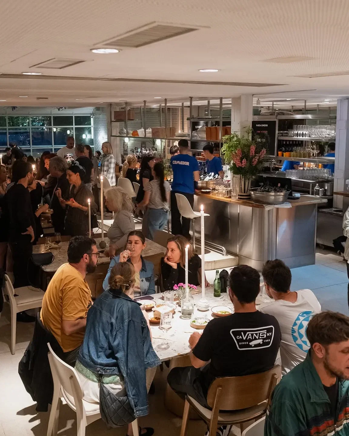 Busy interior of Narda Comedor in Buenos Aires, with diners enjoying the evening.
