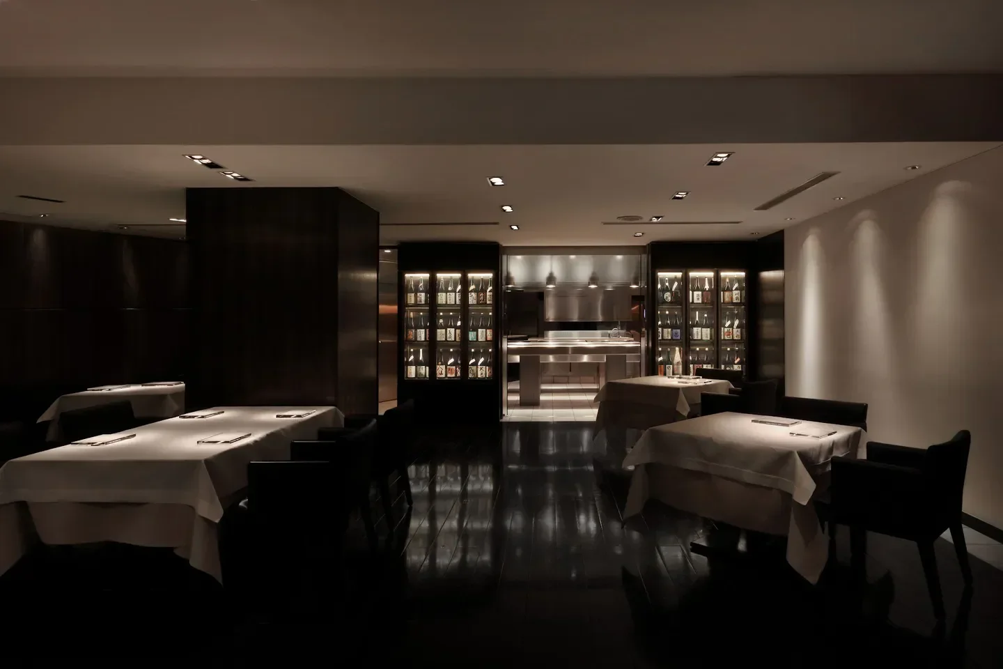 Elegant dining room interior at Narisawa in Tokyo with subdued lighting and tables
