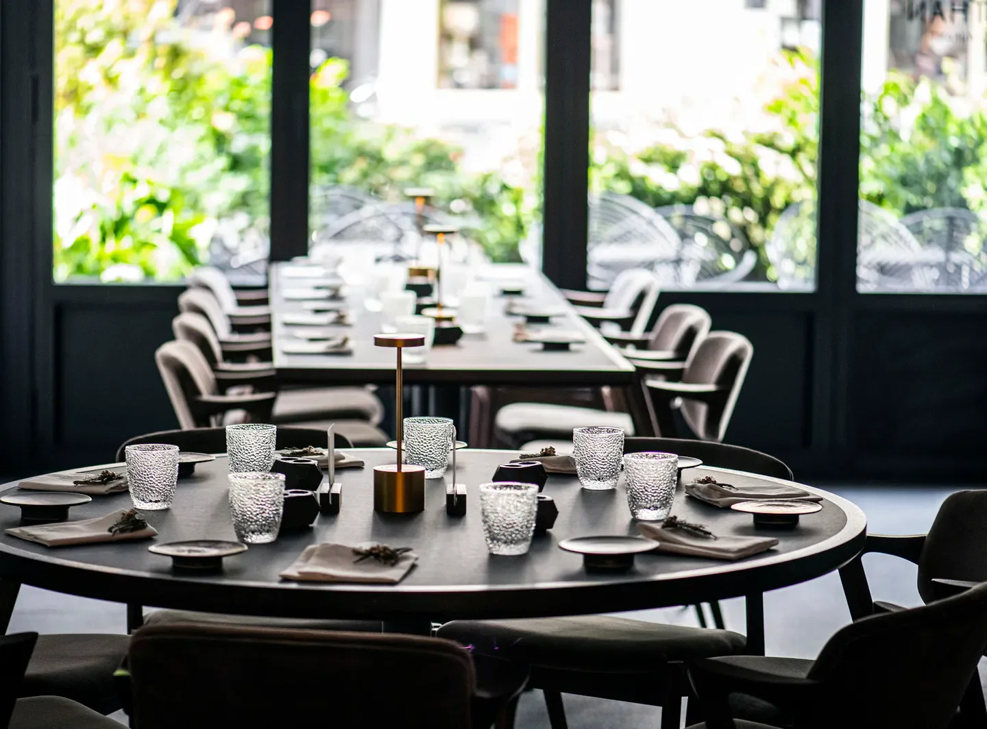 Elegant dining at Nathan restaurant in Antwerp. Interior shot with tables set.