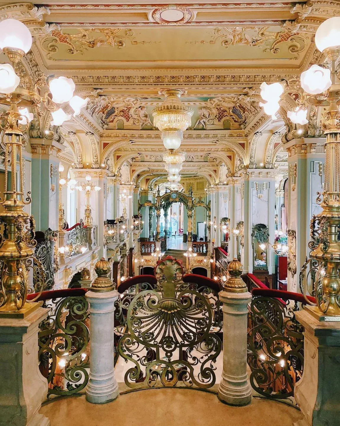 Ornate interior of New York Cafe in Budapest, showcasing luxurious decor and architecture.