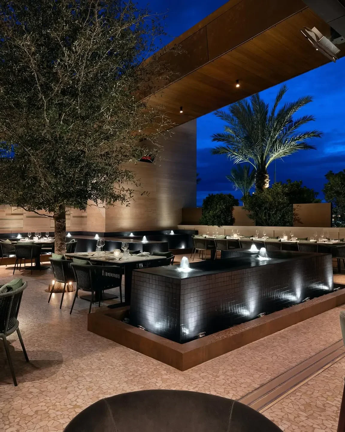 Outdoor dining at Nicco's Prime Cuts & Fresh Fish in Las Vegas, featuring fountains and ambiance