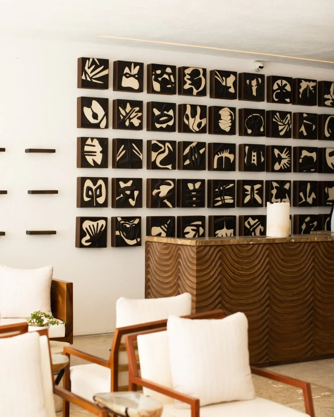Interior of Nido Cevichería Bar in San José del Cabo, with modern art and seating.