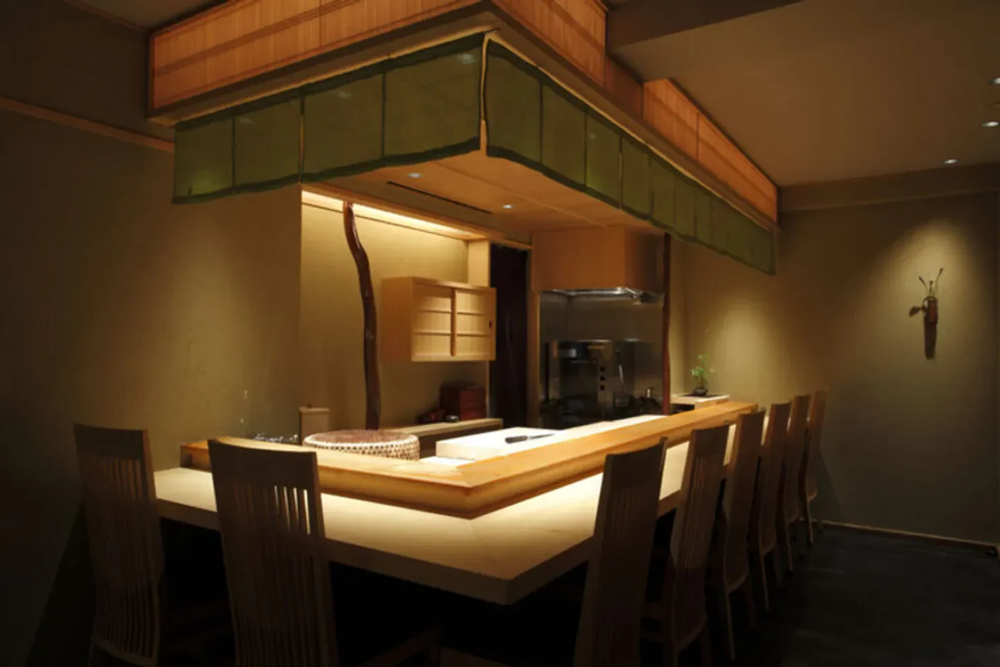 Interior of Nishiazabu Sushi Shin restaurant in Tokyo, showcasing elegant wooden sushi bar.