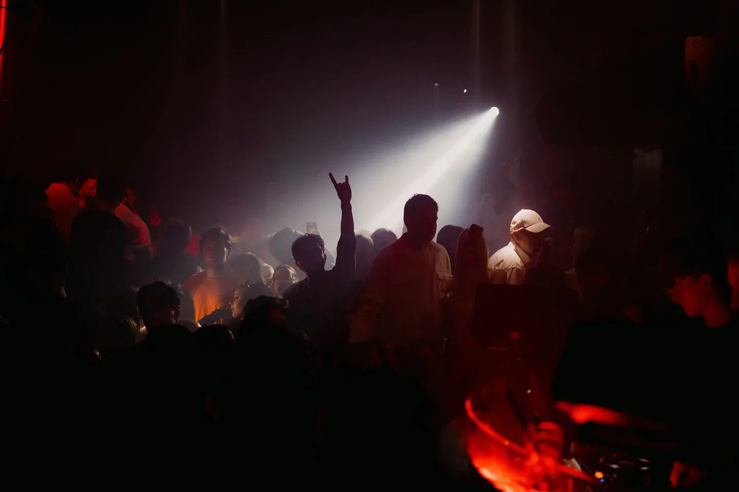 Energetic crowd at NOHO Club in Hamburg, Germany, enjoying a night out with music and lively atmosphere.