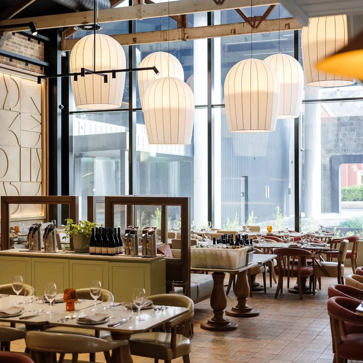 Interior of North & Common restaurant in Melbourne, featuring large pendant lights.