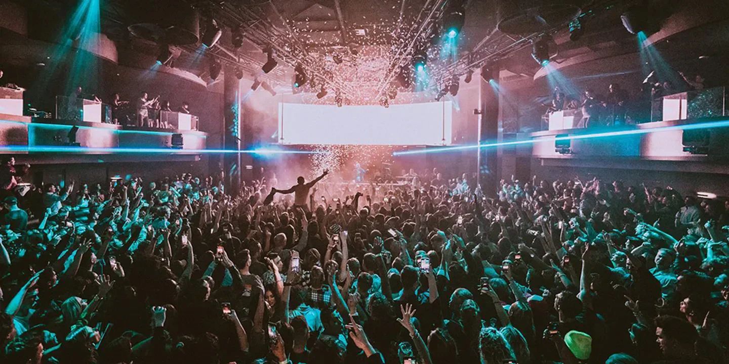 Energetic crowd at Nova nightclub in San Diego, confetti falling on the dance floor.