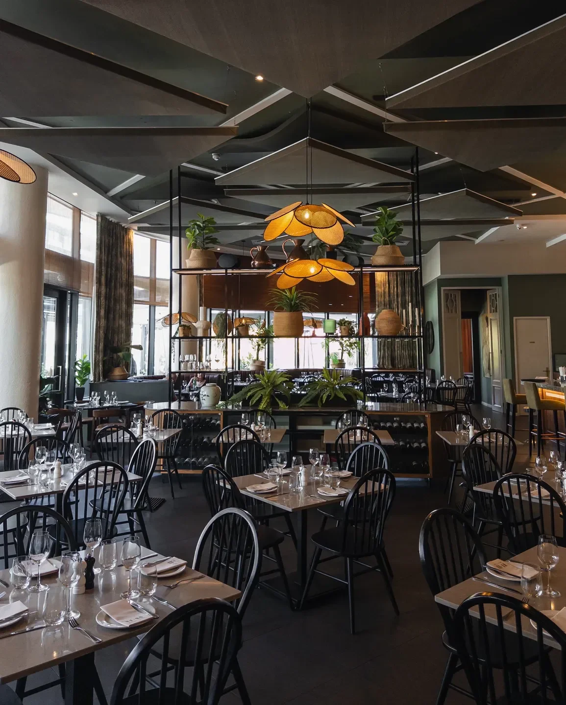 Elegant interior of NV-80 restaurant in Cape Town, featuring stylish decor and dining tables.
